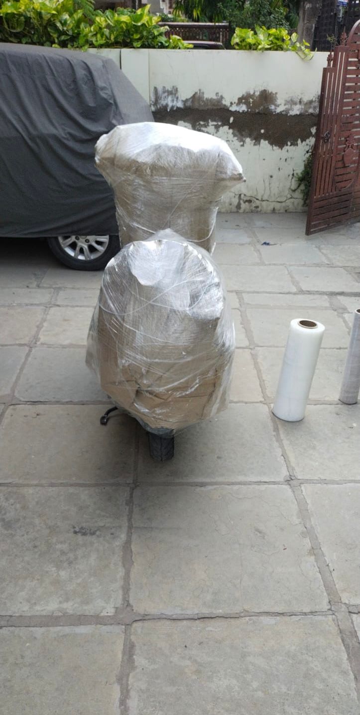 Two wheeler scooter packed with corrugated sheets