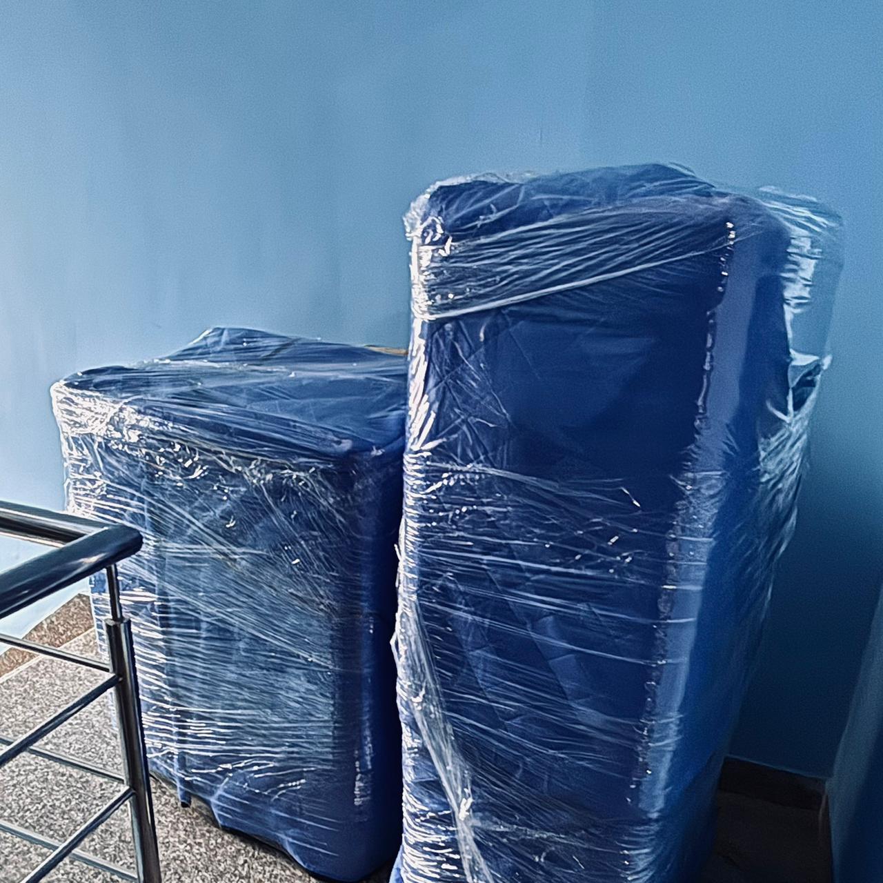 Dual appliances wrapped in blue quilt